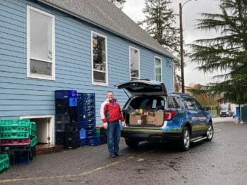 CEO Aaron Goff delivering food boxes to those in-need.
