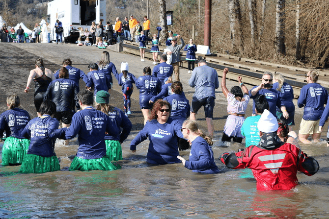 Embold polar plungers walking into the river