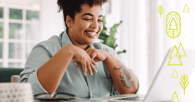 woman smiling at computer